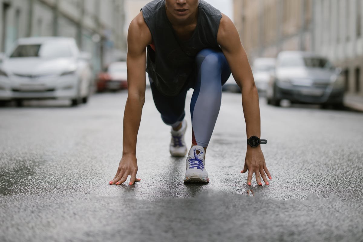 Runner checking GPS watch during a run